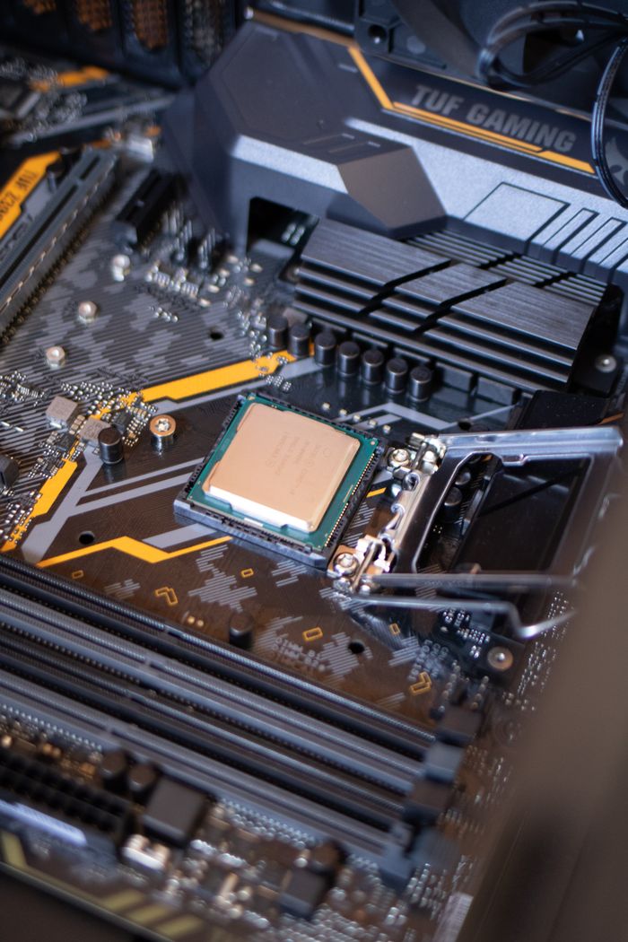 about-02 Detailed view of a motherboard with an exposed CPU, showcasing technology components.
